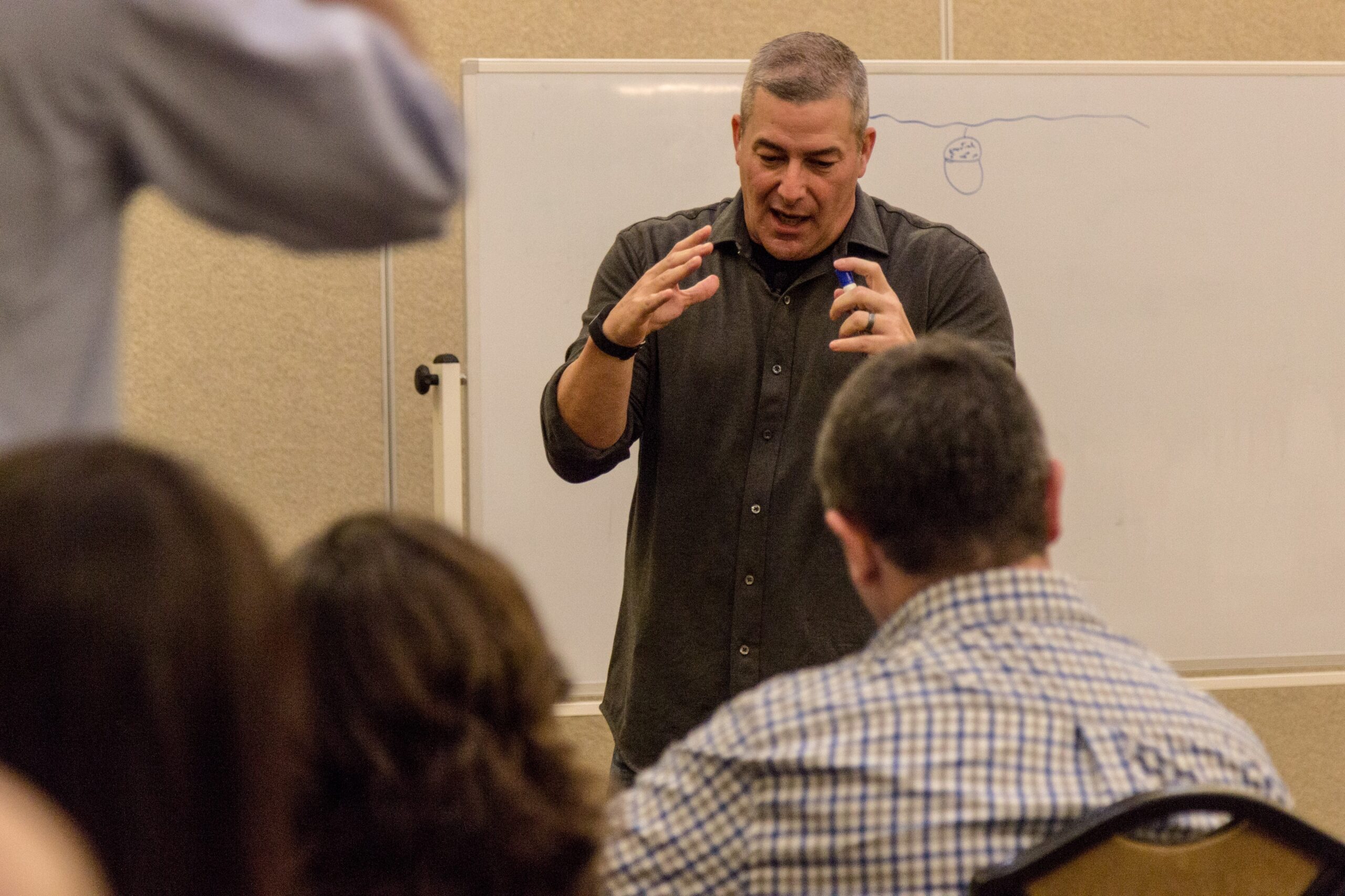Todd McBroom training sales team in conference room